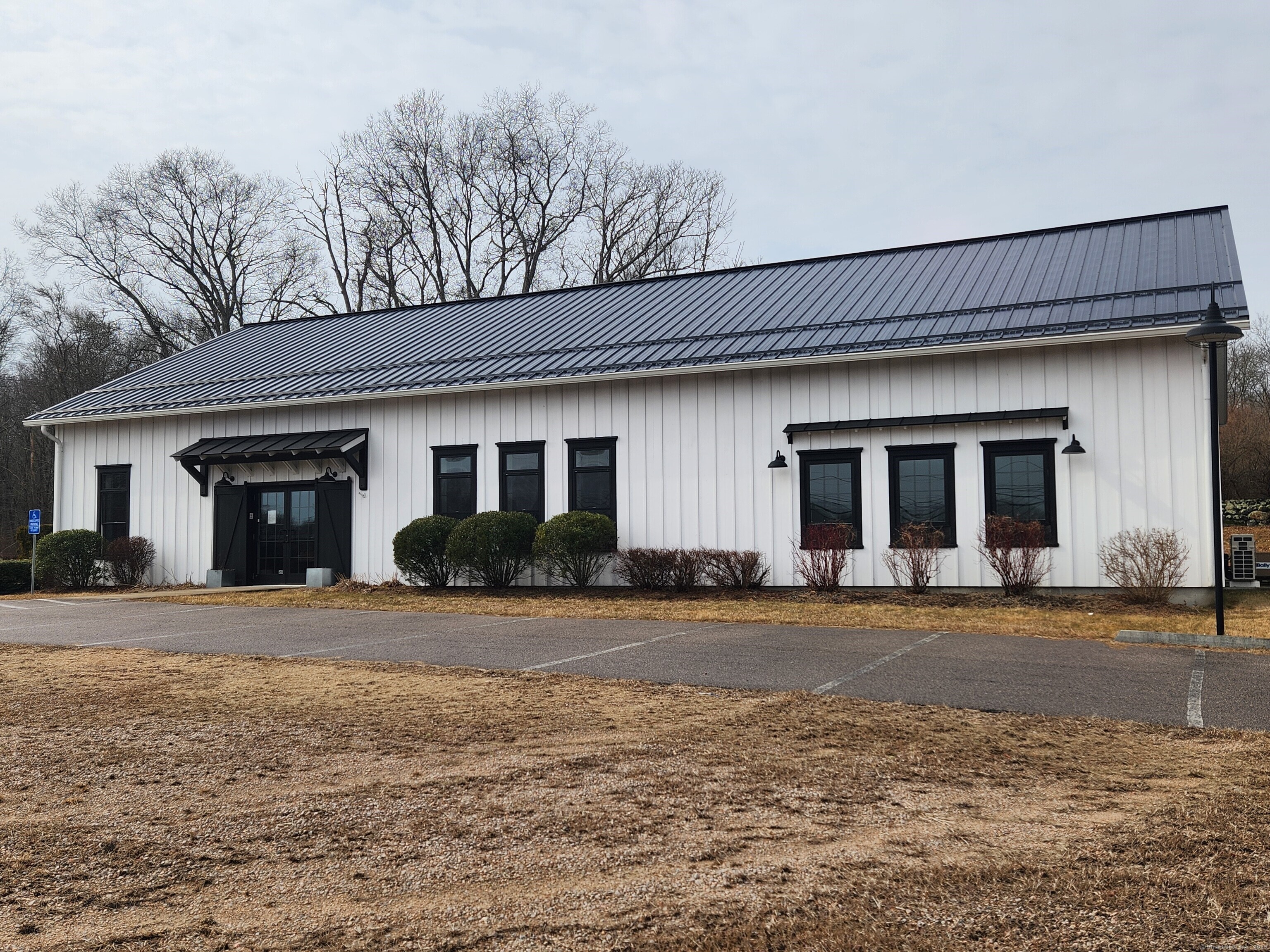 81 Norwich-Westerly Road North Stonington, CT 06359 - Photo 1 of 1 a front view of a house with a yard and garage