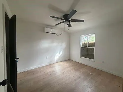 a view of an empty room with a window