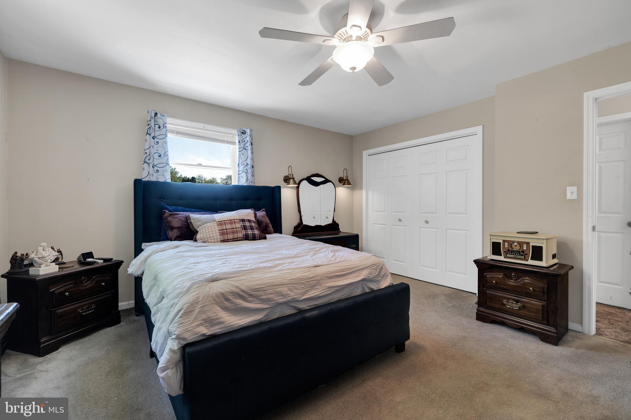 97 Bertolet Mill Road Oley, PA 19547 - Photo 15 of 35 a bedroom with a bed and a chandelier