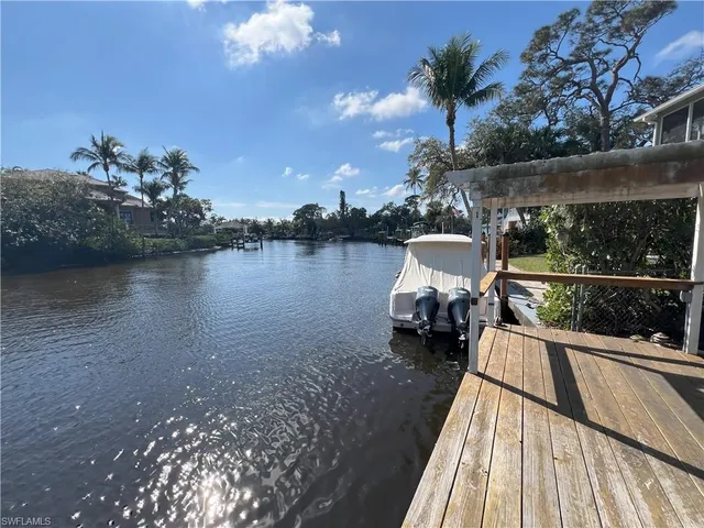 a view of a lake with sitting area