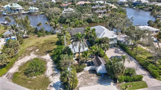 an aerial view of a house with a yard and garden