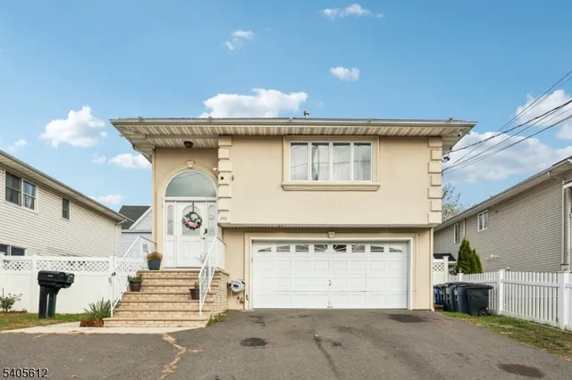 a front view of a house with a garage