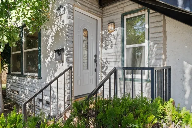 a view of a door and a window