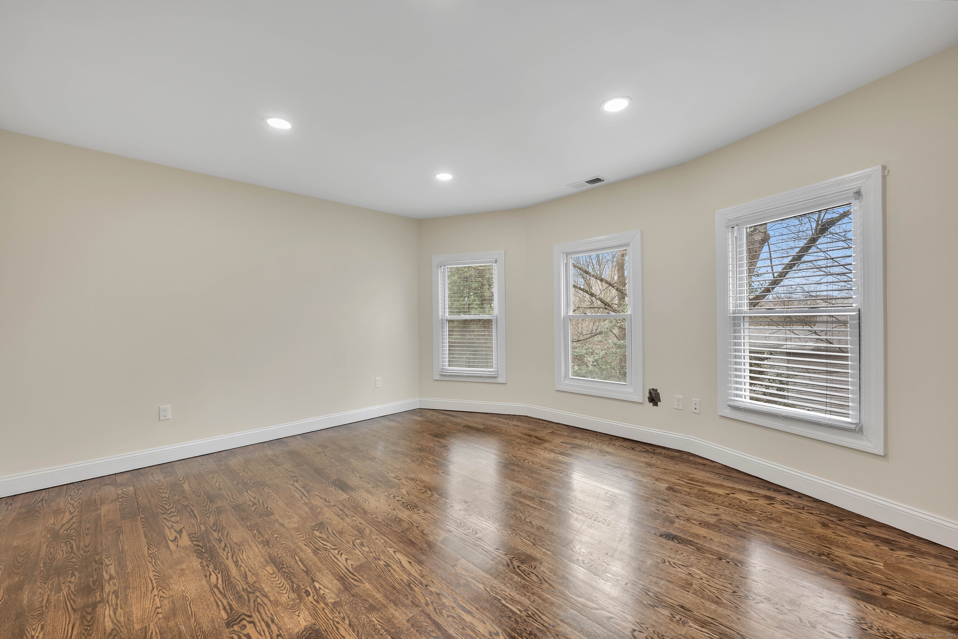550 New Hanover Avenue Meriden, CT 06451 - Photo 13 of 34 a view of an empty room with wooden floor and a window