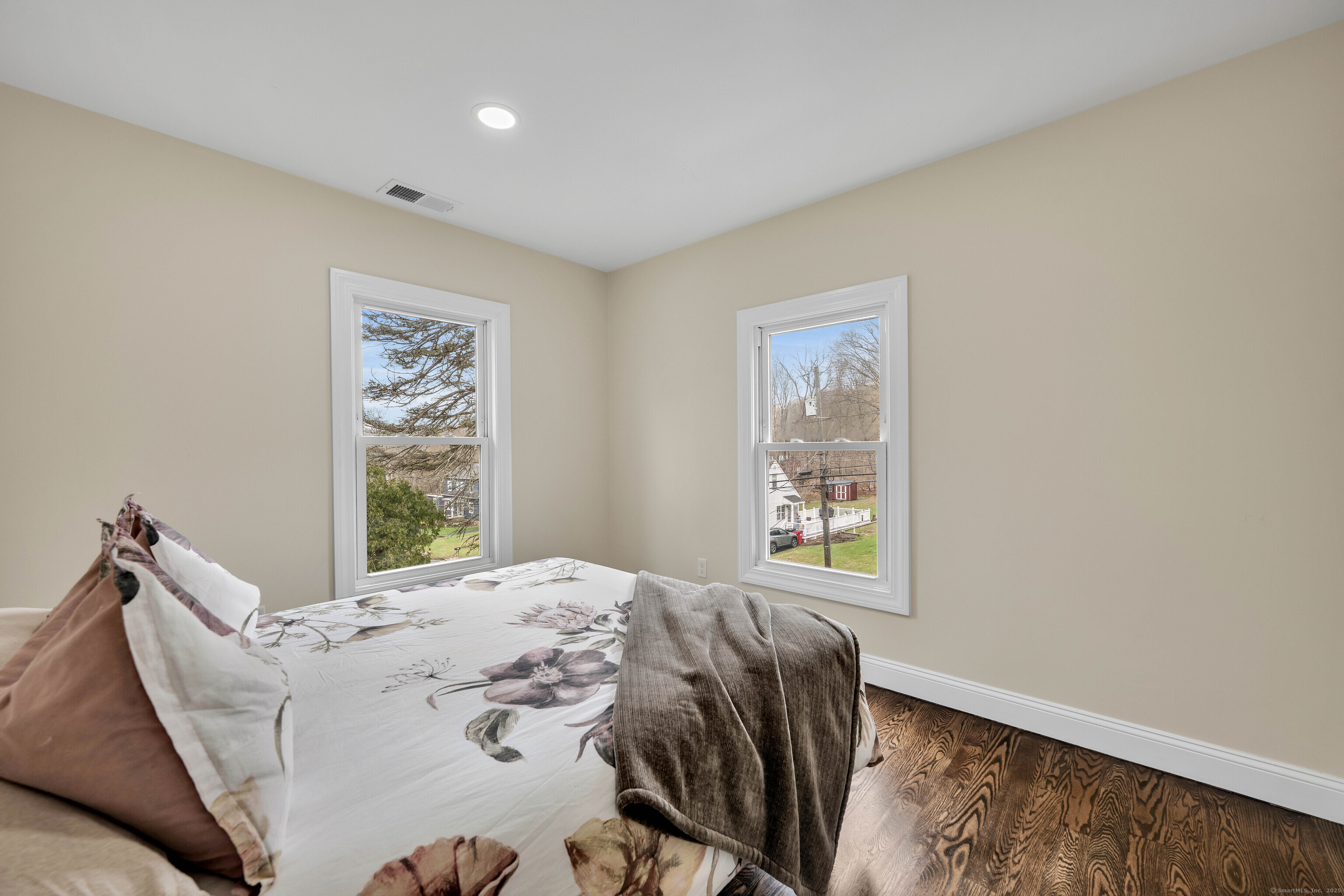 550 New Hanover Avenue Meriden, CT 06451 - Photo 16 of 34 a bed sitting in a bedroom next to a window