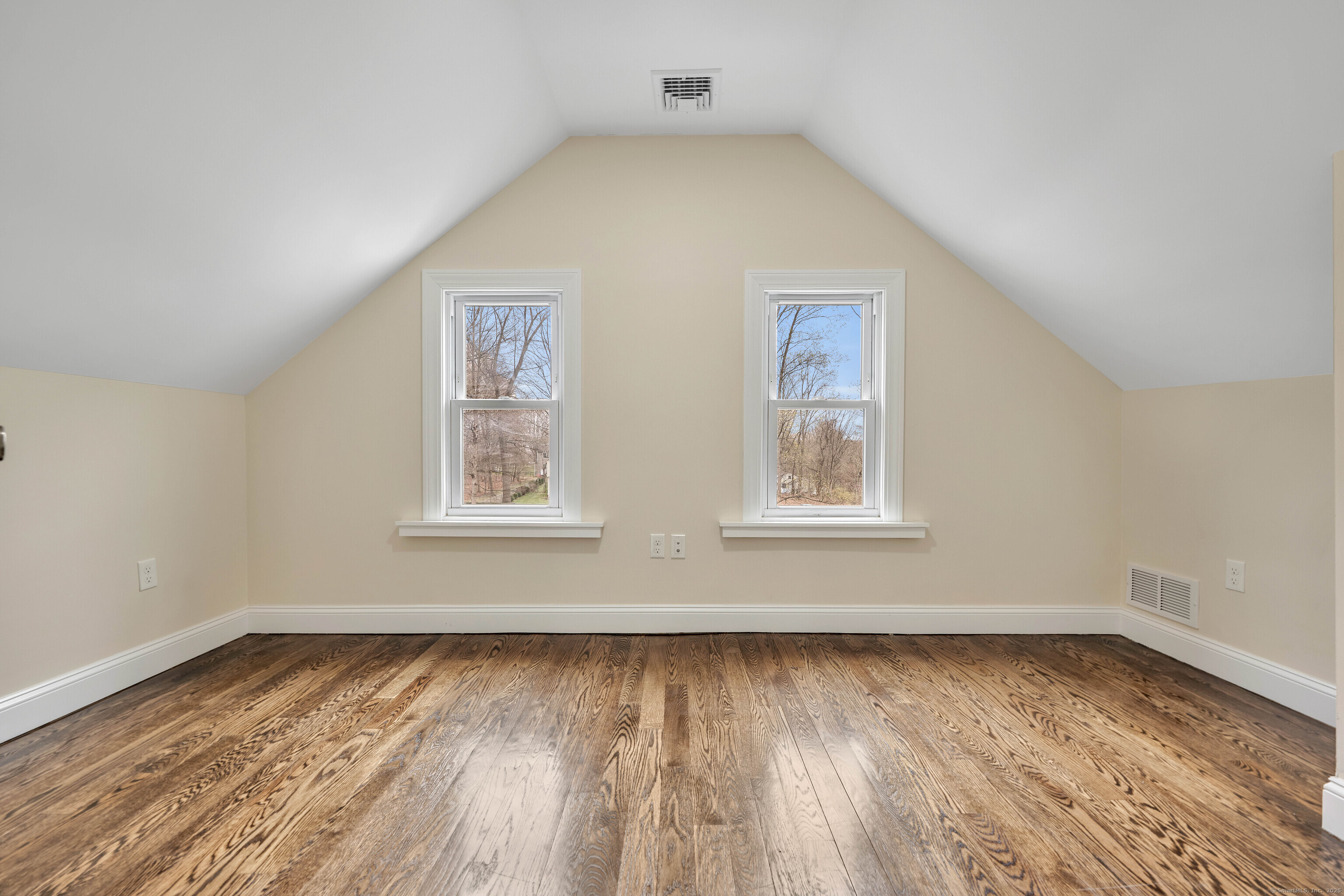 550 New Hanover Avenue Meriden, CT 06451 - Photo 19 of 34 a view of an empty room with wooden floor and a window