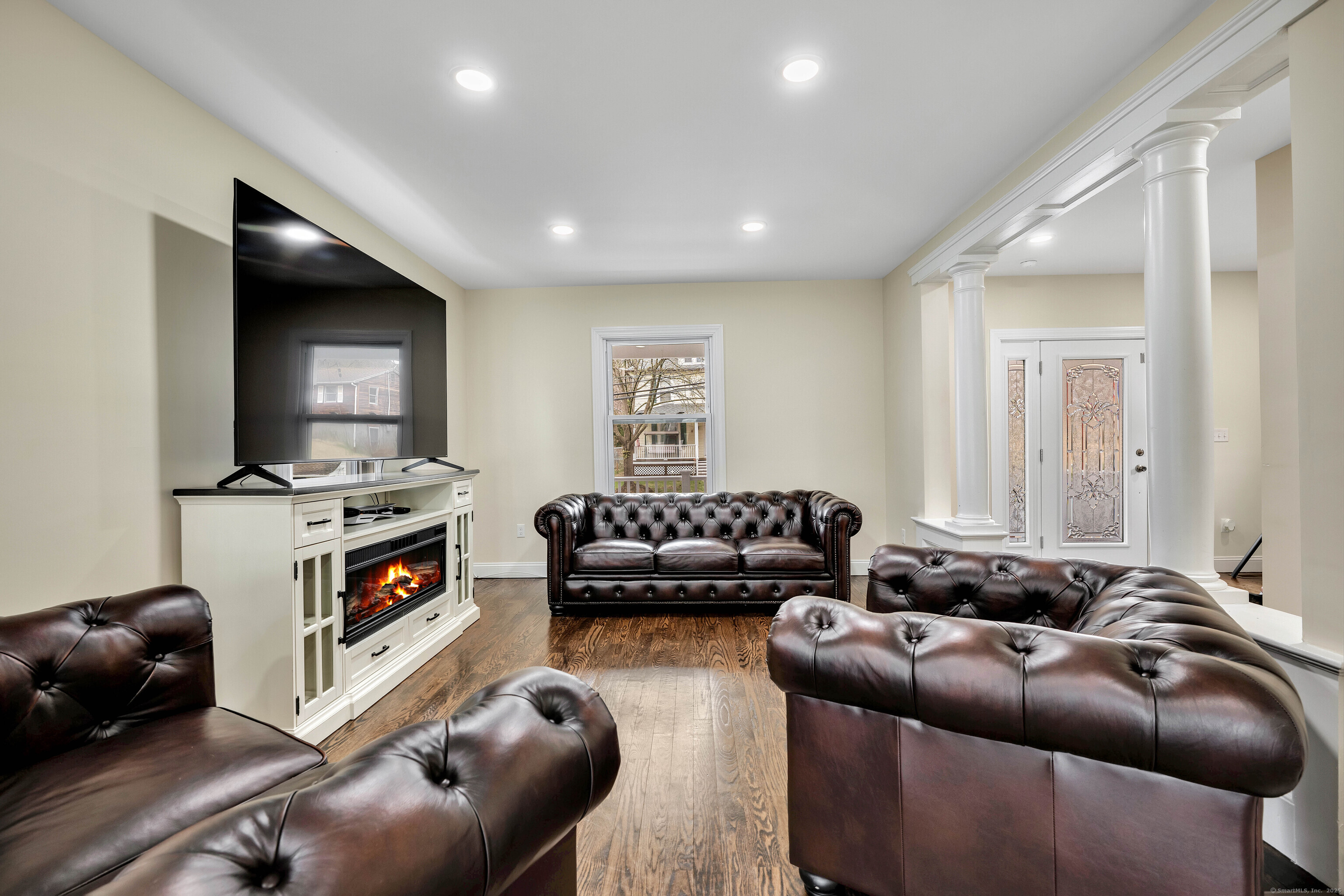 550 New Hanover Avenue Meriden, CT 06451 - Photo 8 of 34 a living room with furniture and a flat screen tv