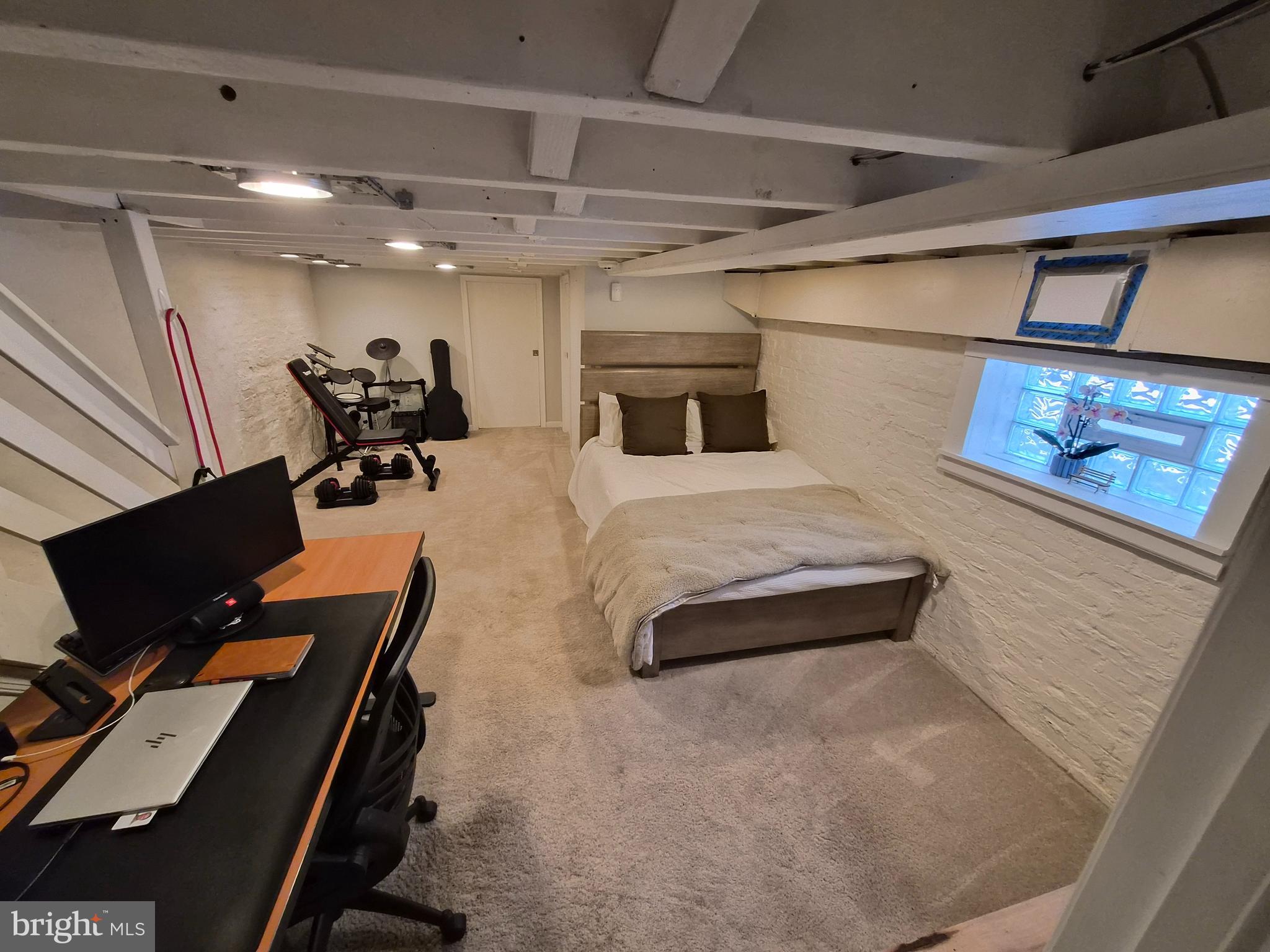 1601 Belt Street Baltimore, MD 21230 - Photo 22 of 30 a bedroom with furniture and a flat screen tv