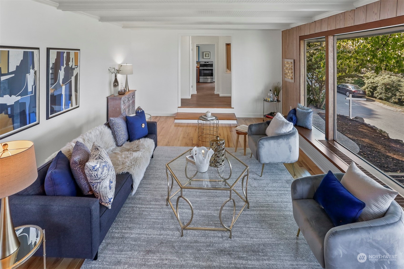 3245 Northwest Esplanade Seattle, WA 98117 - Photo 16 of 38 a living room with furniture and a floor to ceiling window