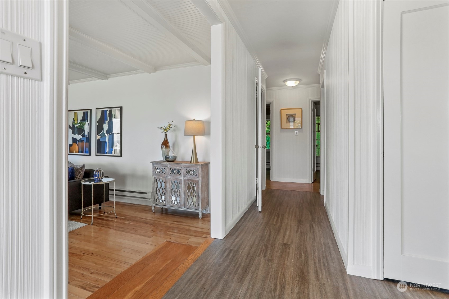 3245 Northwest Esplanade Seattle, WA 98117 - Photo 18 of 38 a view of a hallway with wooden floor windows and livingroom with wooden floor