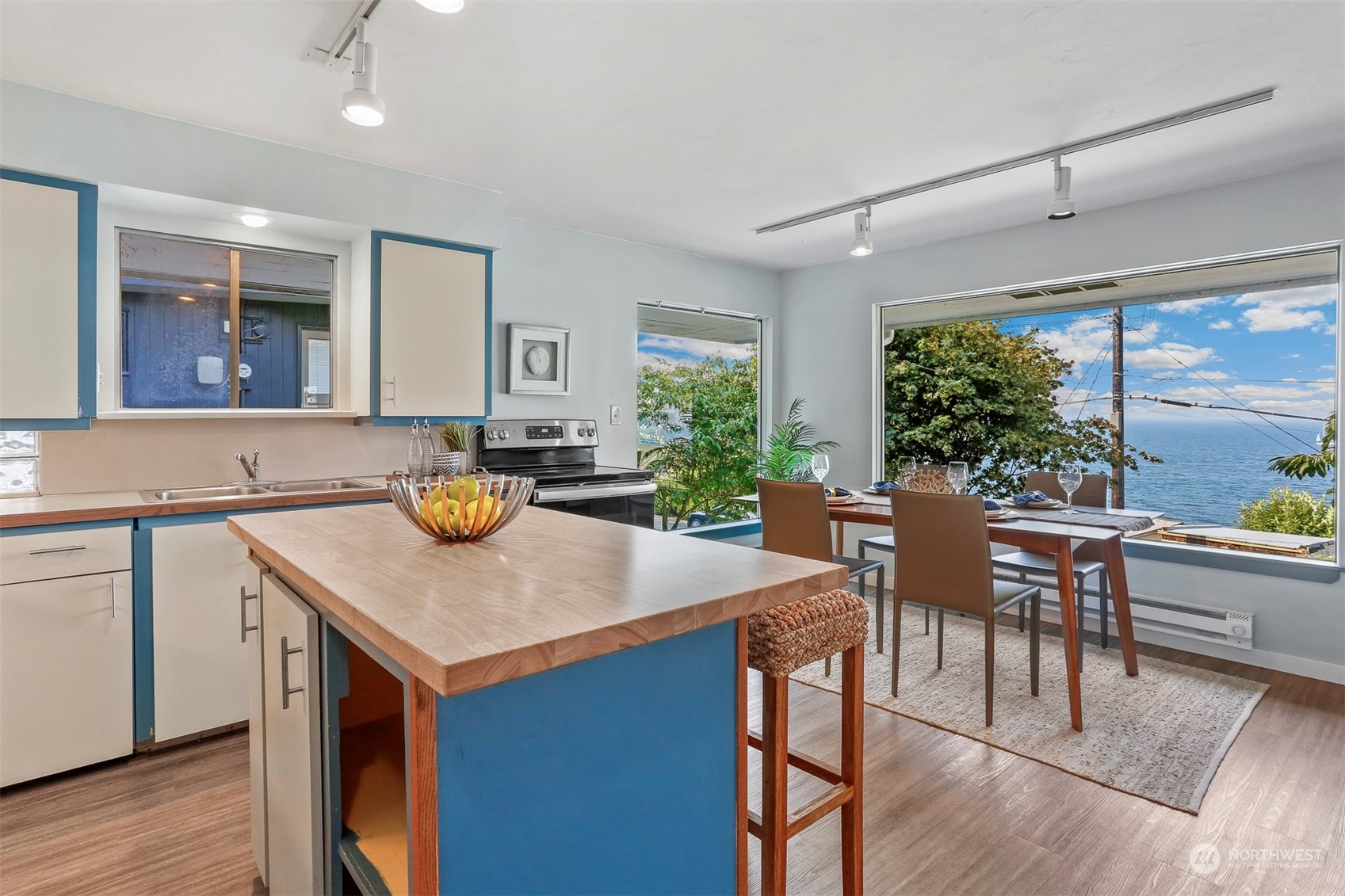 3245 Northwest Esplanade Seattle, WA 98117 - Photo 26 of 38 a kitchen with a table chairs and wooden floor