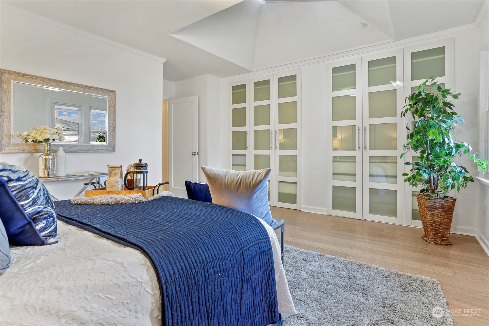 3245 Northwest Esplanade Seattle, WA 98117 - Photo 30 of 38 a bed room with a bed and potted plant