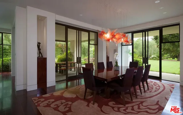 a house with swimming pool in front of it