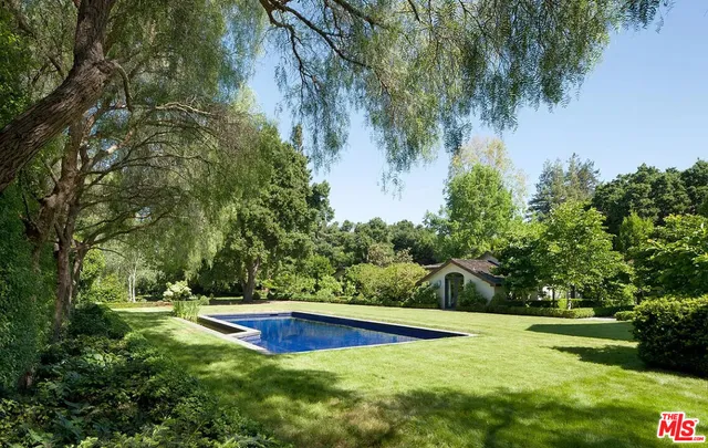 a view of a table and chairs in the garden
