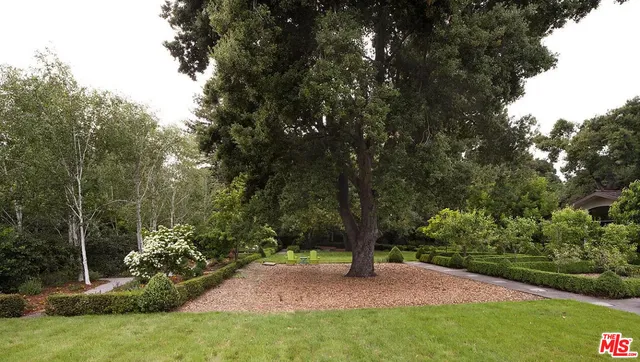 a view of an entryway with wooden floor and door