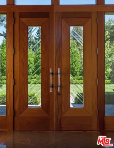 a view of a livingroom with furniture and front door