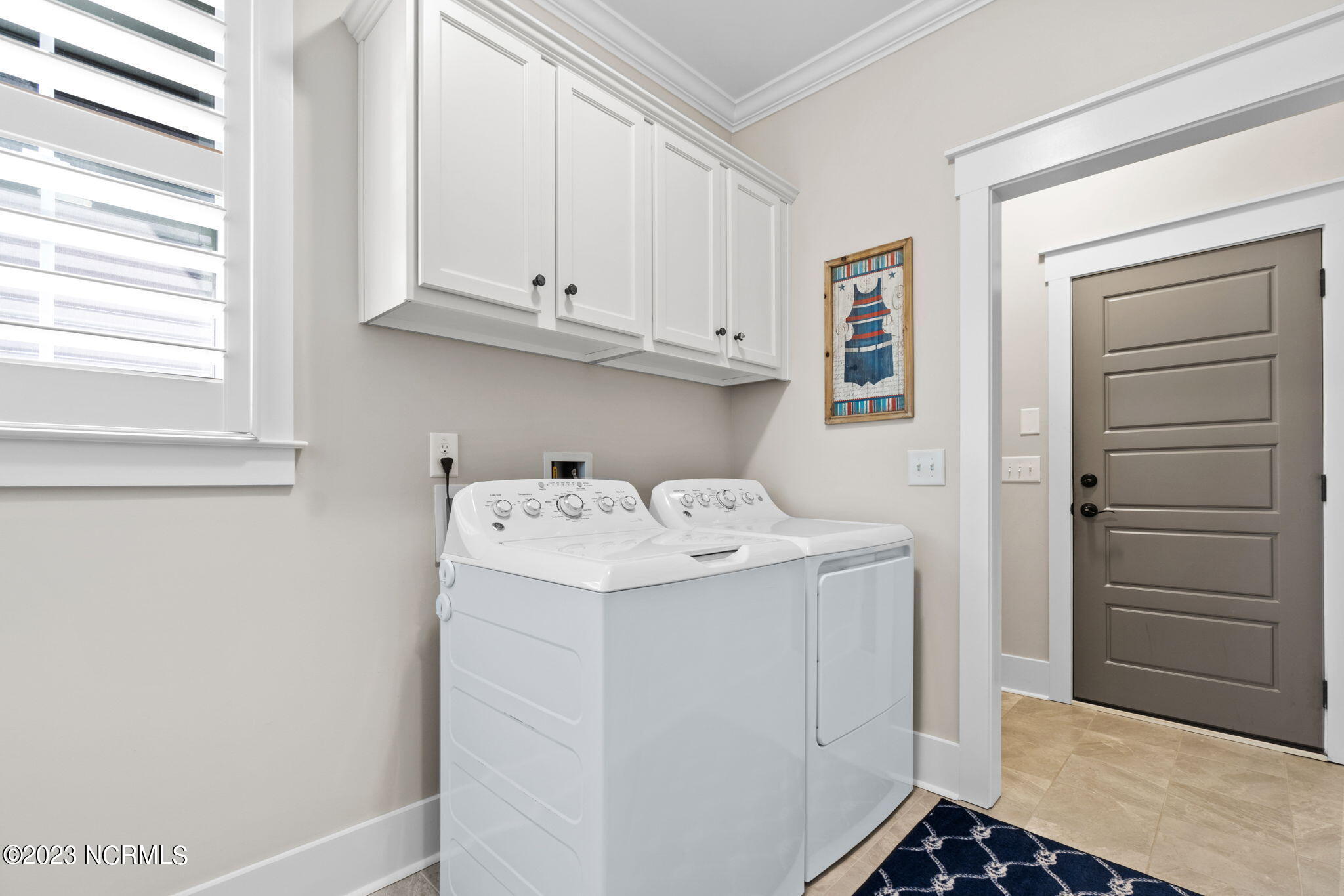1398 Long Pond Road Southwest Ocean Isle Beach, NC 28469 - Photo 32 of 48 Laundry room with cabinet storage above
