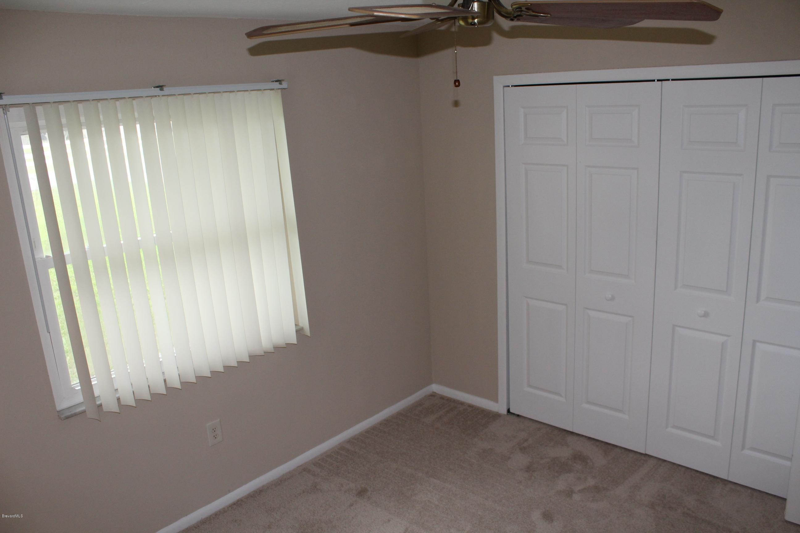 4565 Delespine Road Cocoa, FL 32927 - Photo 14 of 32 2nd bedroom with closet view