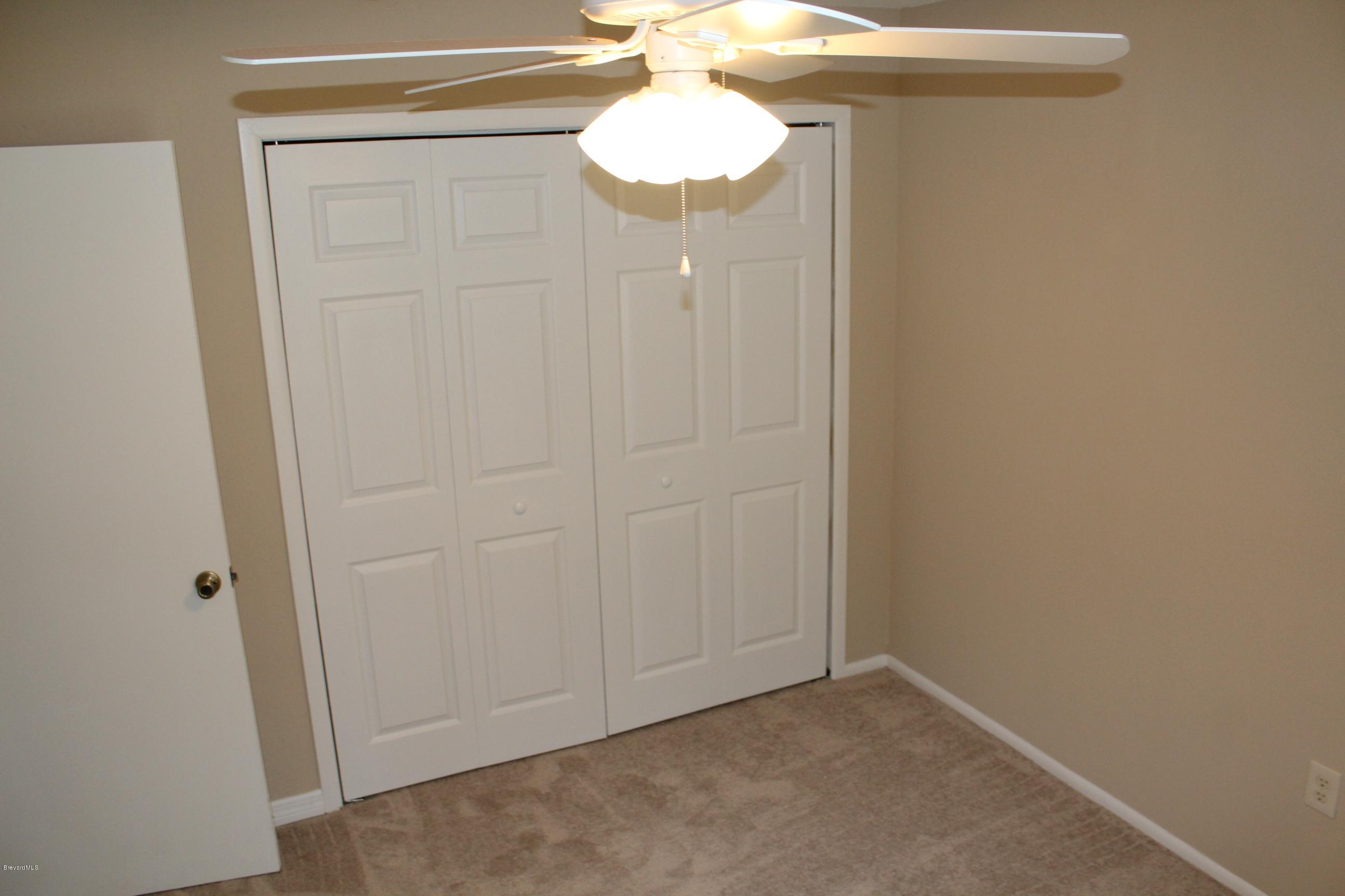 4565 Delespine Road Cocoa, FL 32927 - Photo 17 of 32 3rd bedroom with closet view