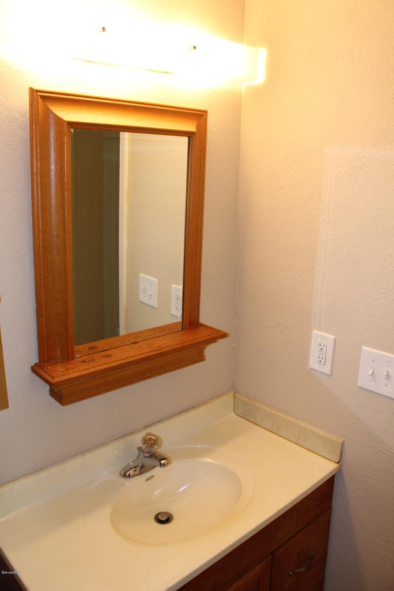 4565 Delespine Road Cocoa, FL 32927 - Photo 27 of 32 In-law master bath vanity