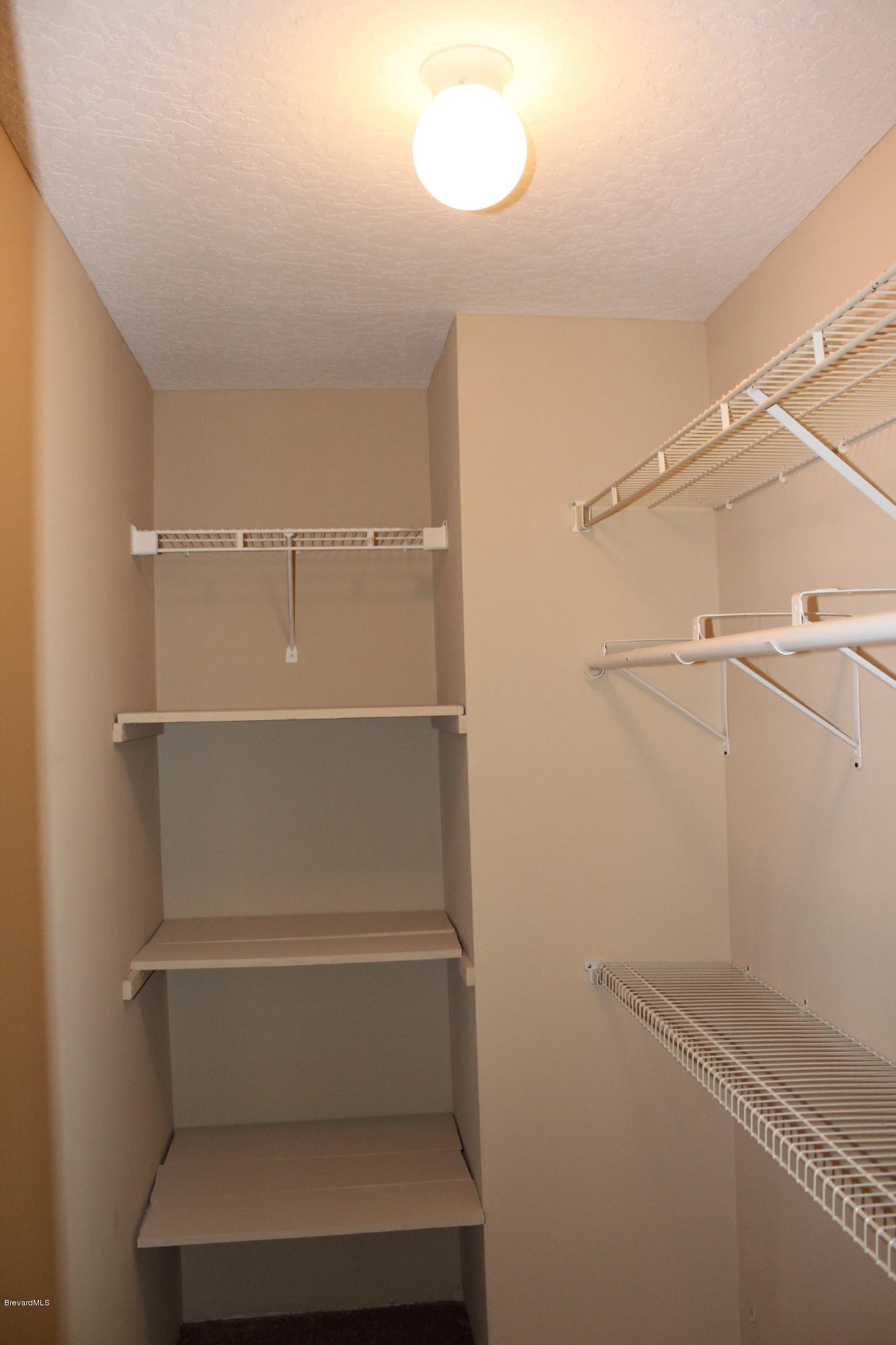 4565 Delespine Road Cocoa, FL 32927 - Photo 10 of 32 Walk-in closet in master bedroom