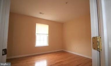 11809 Old Fort Road Fort Washington, MD 20744 - Photo 12 of 21 a view of an empty room with wooden floor and a window