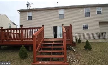 11809 Old Fort Road Fort Washington, MD 20744 - Photo 20 of 21 a view of a house with backyard and wooden floor