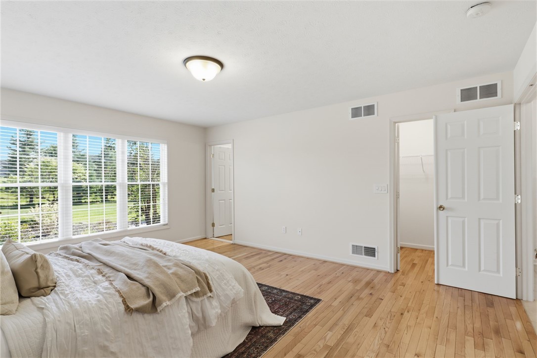 1024 Pondbrook Point Webster, NY 14580 - Photo 13 of 36 Primary Bedroom with Walk-In Closet