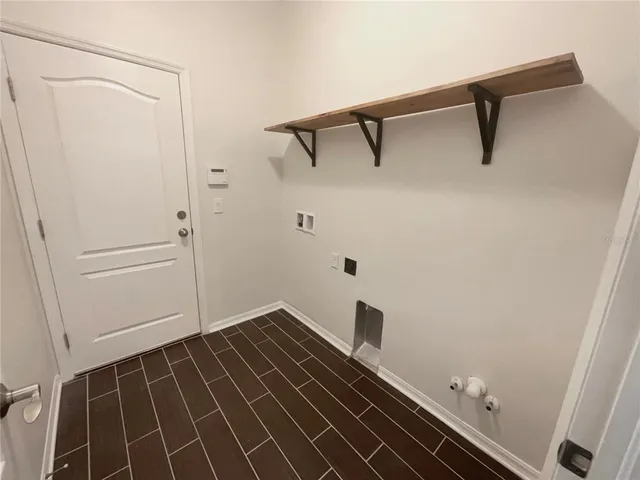 a bathroom with a shower and a sink