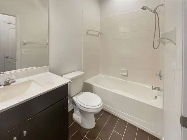a bathroom with a sink a toilet and a bathtub