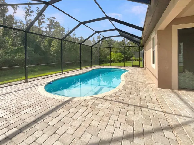 a view of a swimming pool with a porch