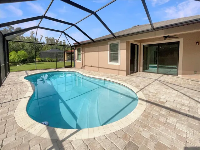 a view of a house with swimming pool