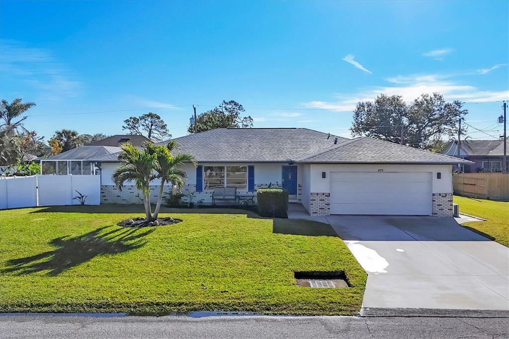 873 Clematis Road Venice, FL 34293 - Photo 1 of 1 a front view of a house with garden