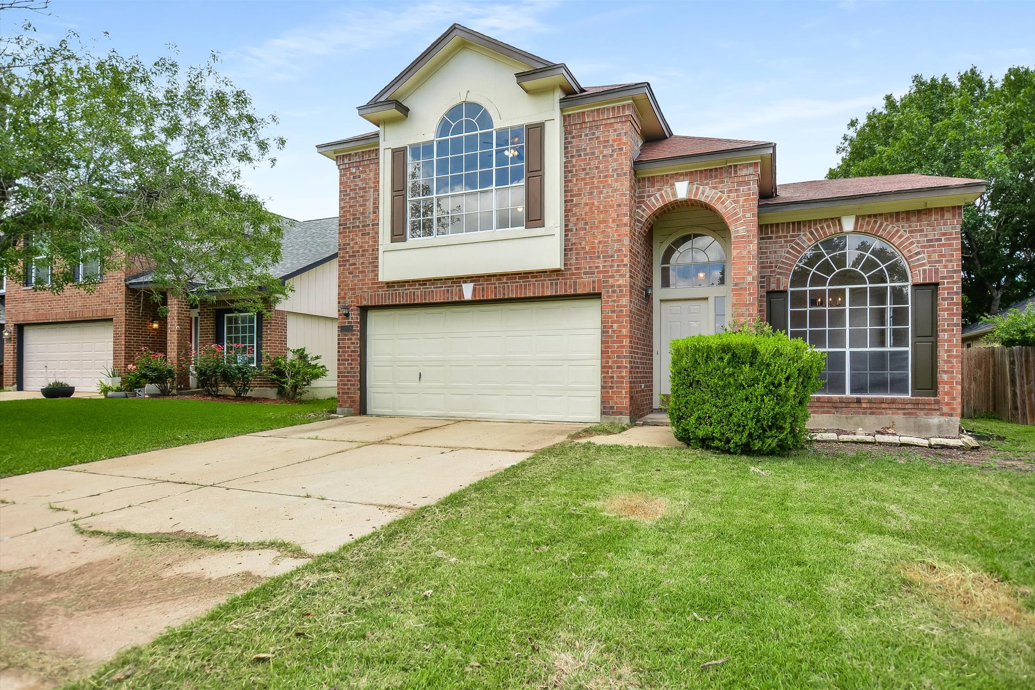 1008 Double File Trail Round Rock, TX 78665 - Photo 2 of 20 Brick facade with arched accents define this charming suburban residence.