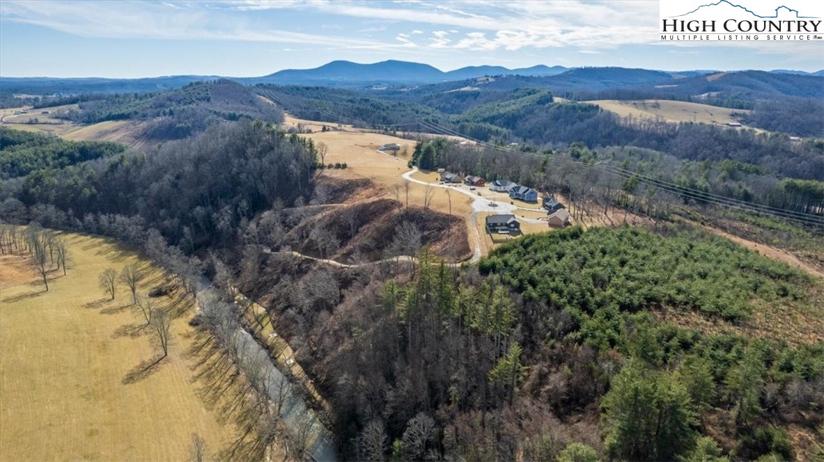 Lot 2 Turtle Ridge Road Sparta, NC 28675 - Photo 5 of 12 a view of a house with a mountain and a forest