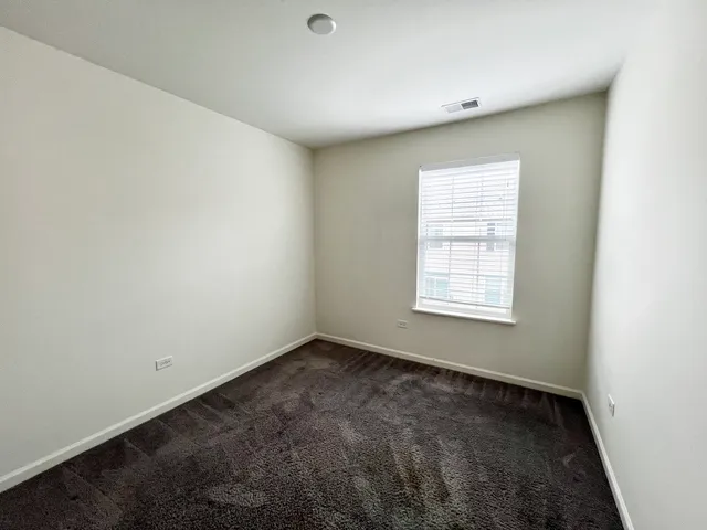 a large white kitchen with wooden floor and floors