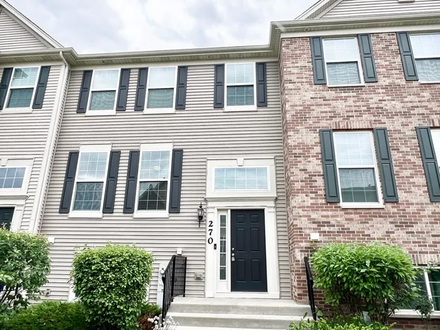 a front view of a house with a garage