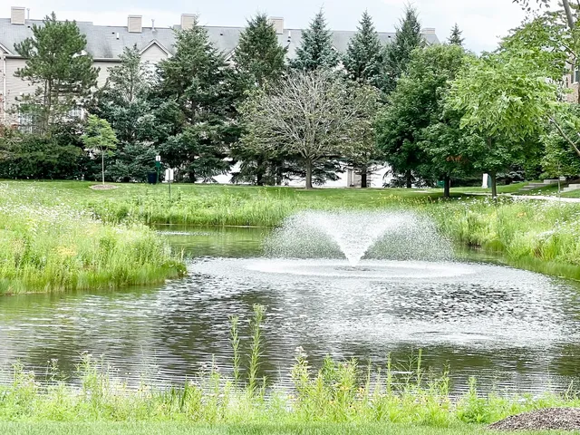a sign that is sitting in front of flowers