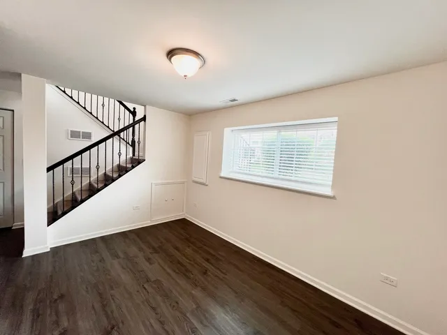 a view of entryway with wooden floor