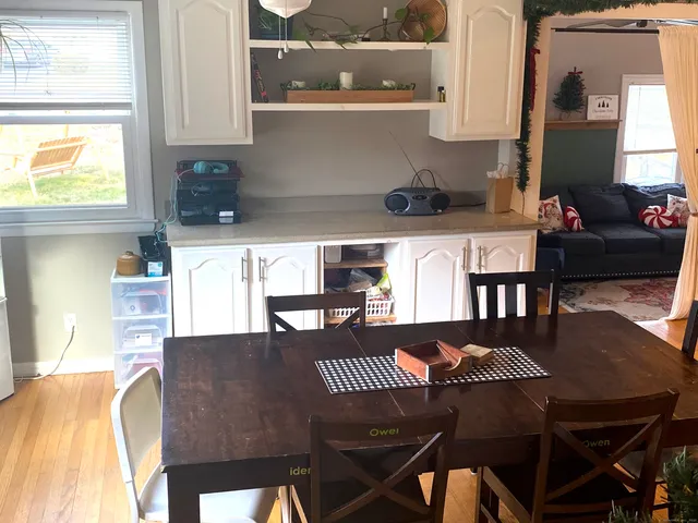 a kitchen with a table chairs and a stove
