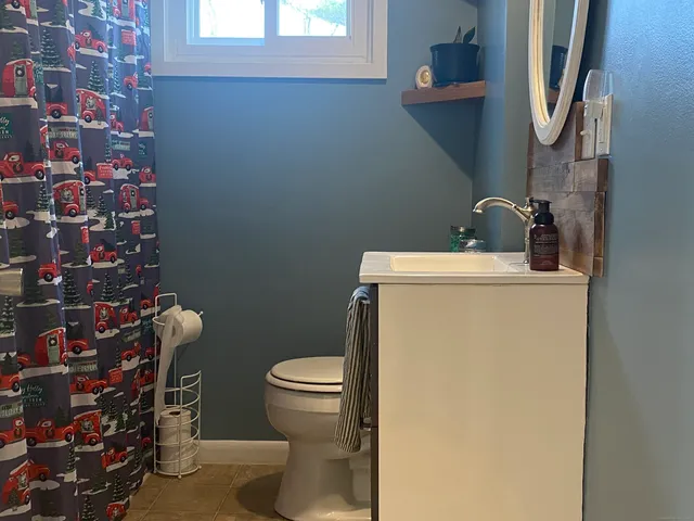 a bathroom with a toilet and a sink