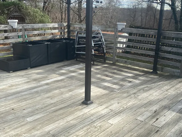 a view of a balcony with wooden floor
