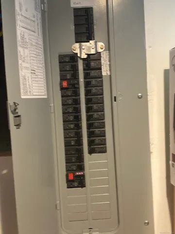 a close view of a utility room with dryer and washer