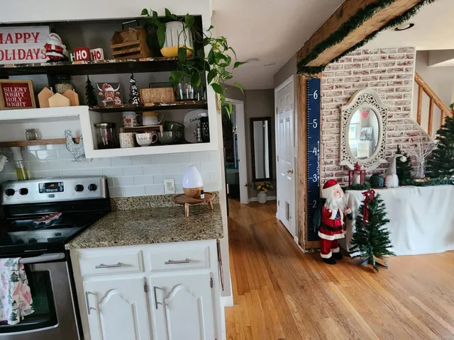 a kitchen with lots of fruit and wooden floor
