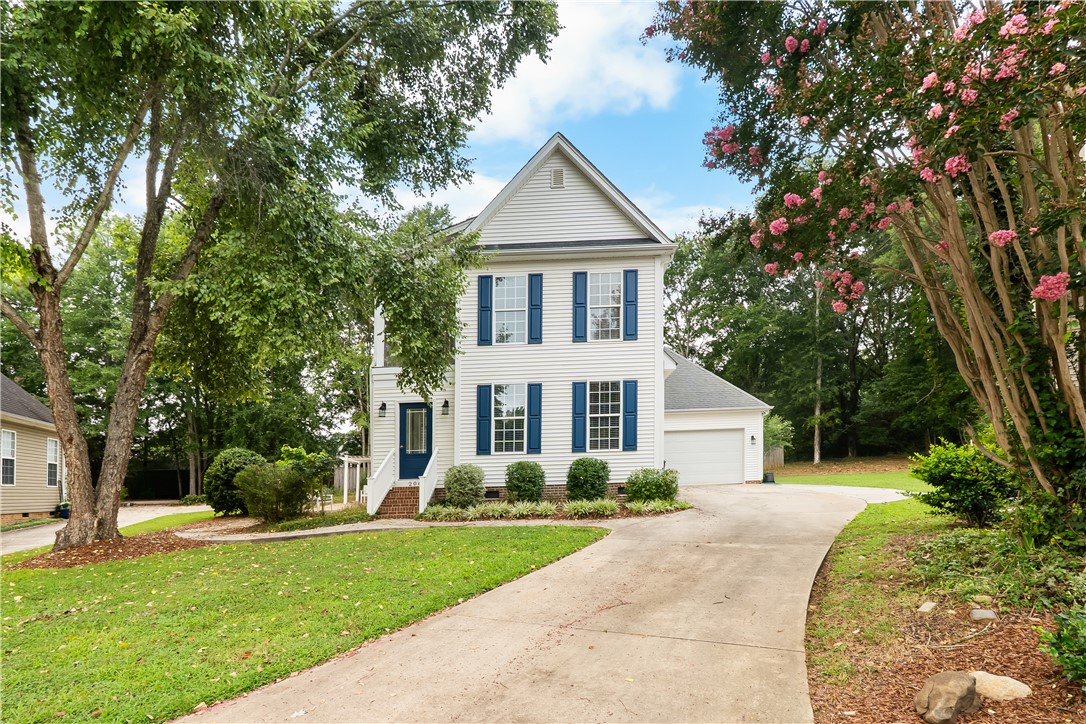 206 Village Way Pendleton, SC 29670 - Photo 45 of 46 A charming facade with contrasting blue shutters and a welcoming front entrance.