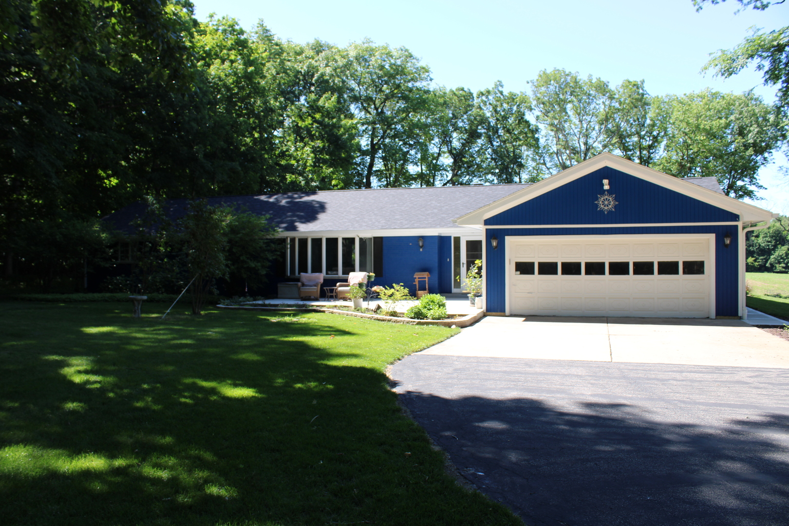 11658 Deerpath Road Sycamore, IL 60178 - Photo 2 of 37 a front view of a house with a garden