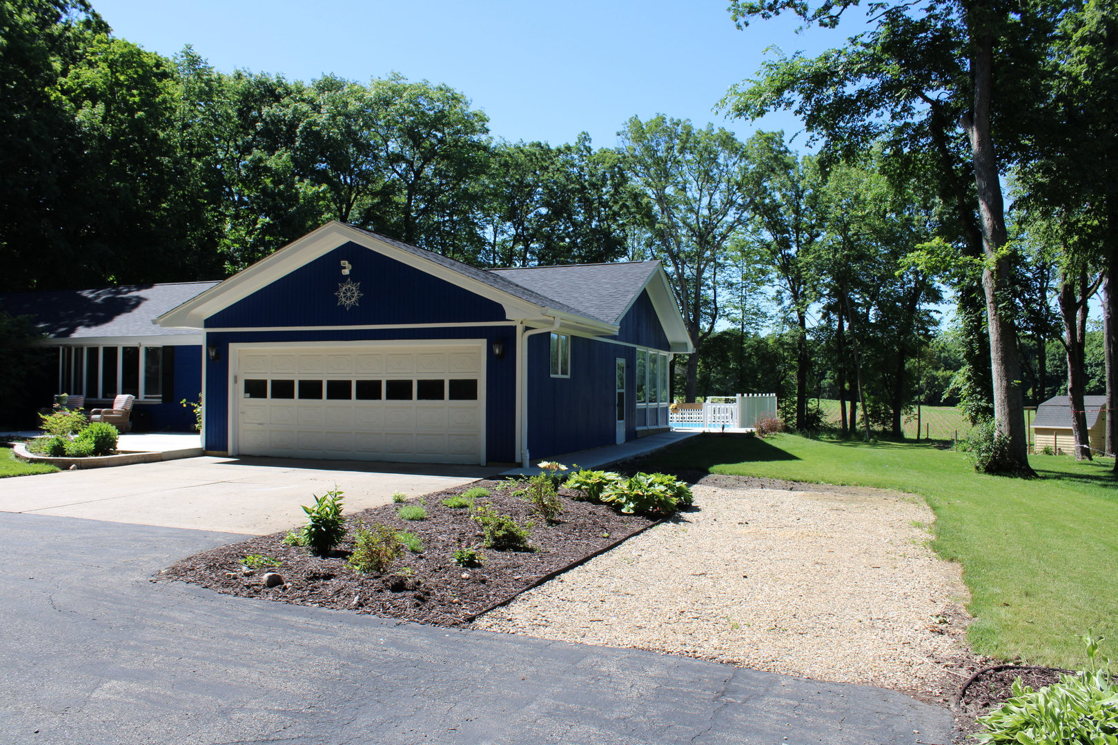 11658 Deerpath Road Sycamore, IL 60178 - Photo 28 of 37 a front view of a house with a garden