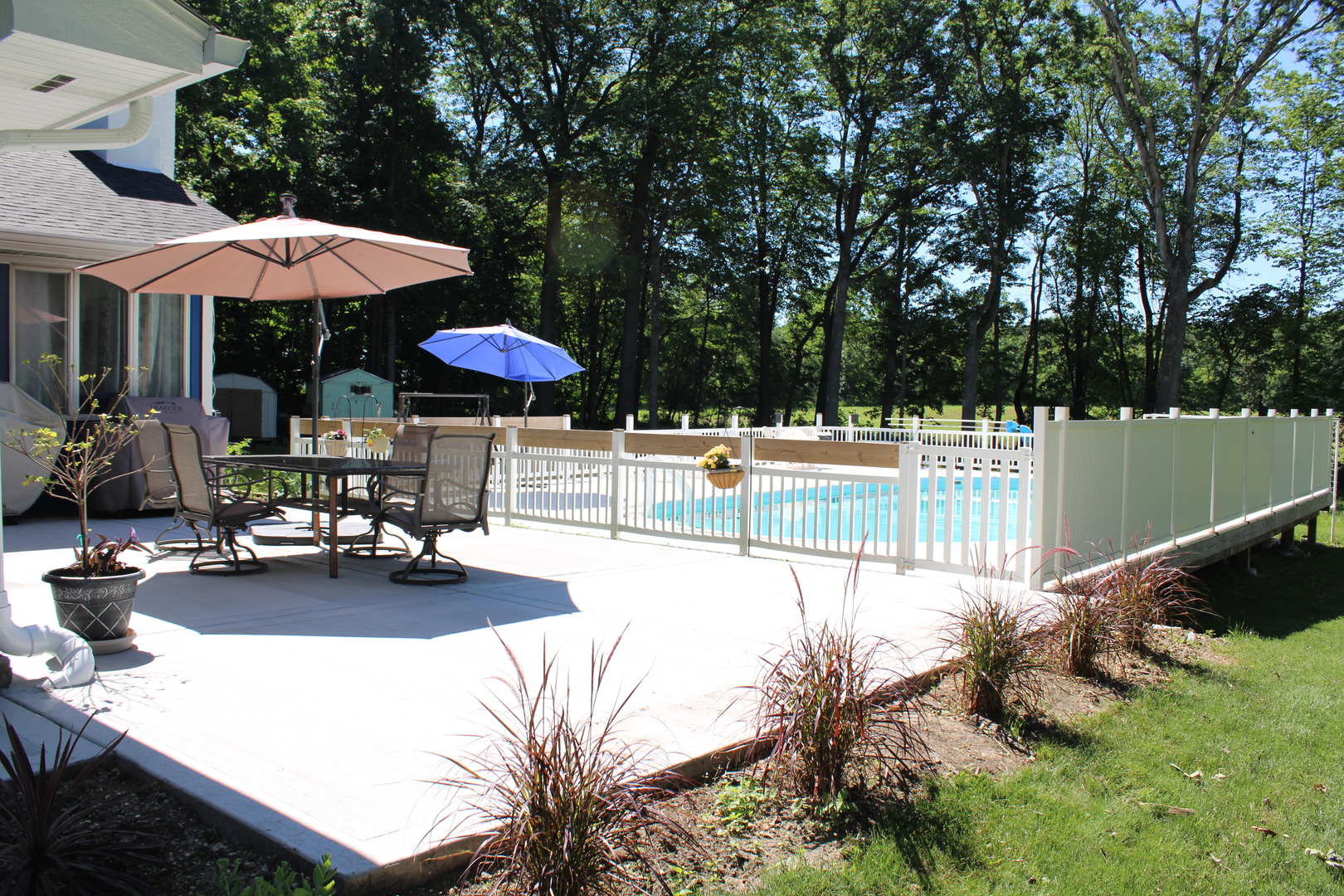 11658 Deerpath Road Sycamore, IL 60178 - Photo 29 of 37 a view of a patio with chairs and a table with chairs