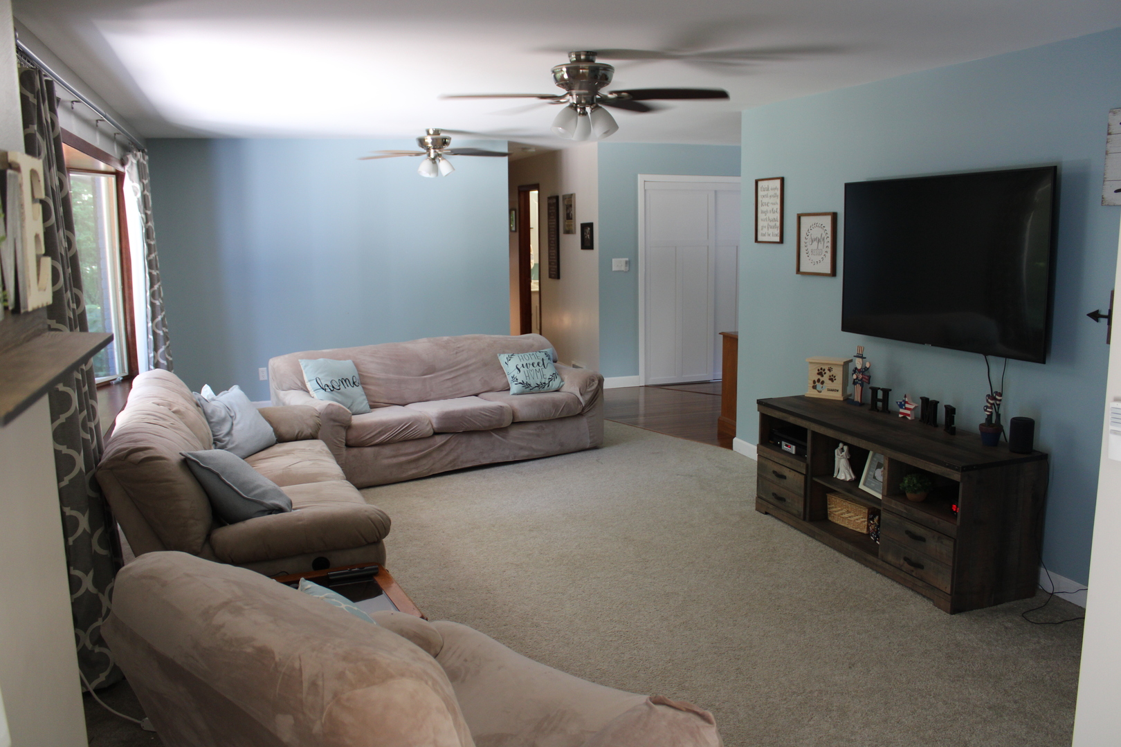 11658 Deerpath Road Sycamore, IL 60178 - Photo 3 of 37 a living room with furniture and a flat screen tv