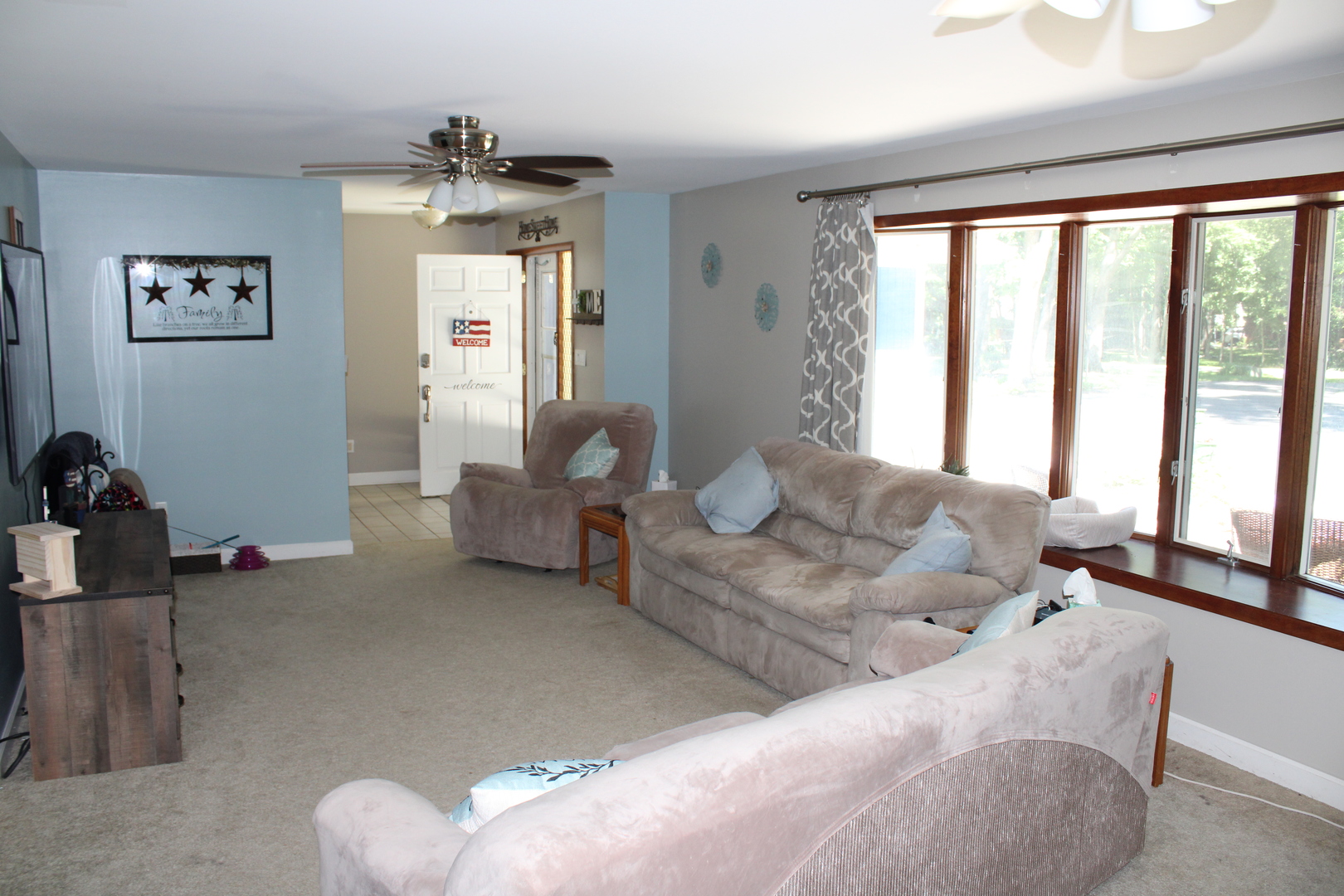 11658 Deerpath Road Sycamore, IL 60178 - Photo 4 of 37 a living room with furniture and a large window